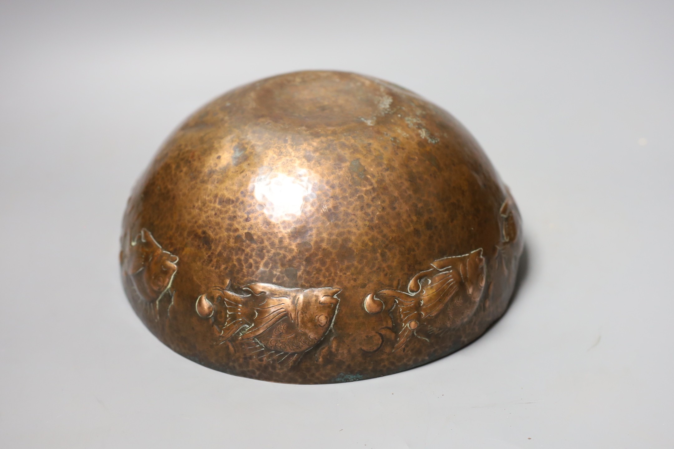 A Newlyn style planished copper ‘fish’ bowl, 24.5 cms diameter